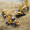 A yellow die-cast toy excavator construction vehicle digging in sand.