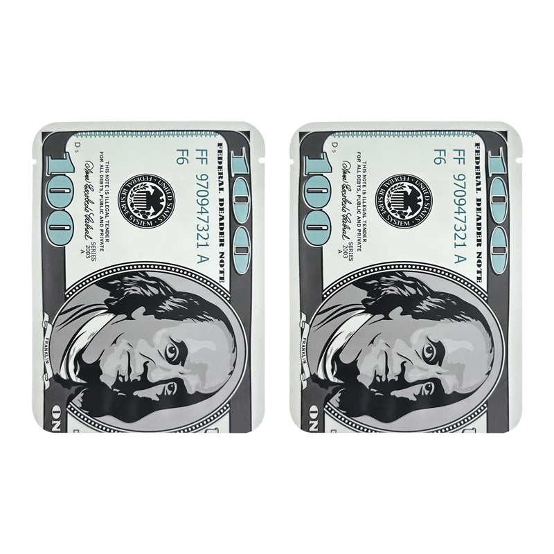 A pair of small, silver-colored mylar bags featuring a dollar sign pattern and an engraved portrait.