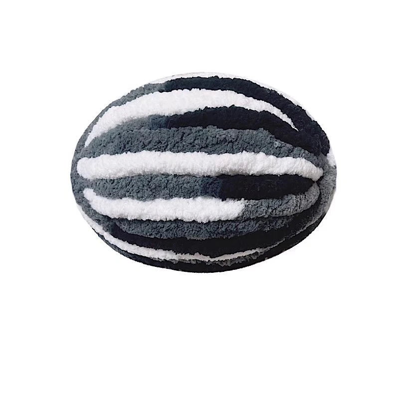 A spherical ball of chunky chenille yarn with horizontal black and white stripes.