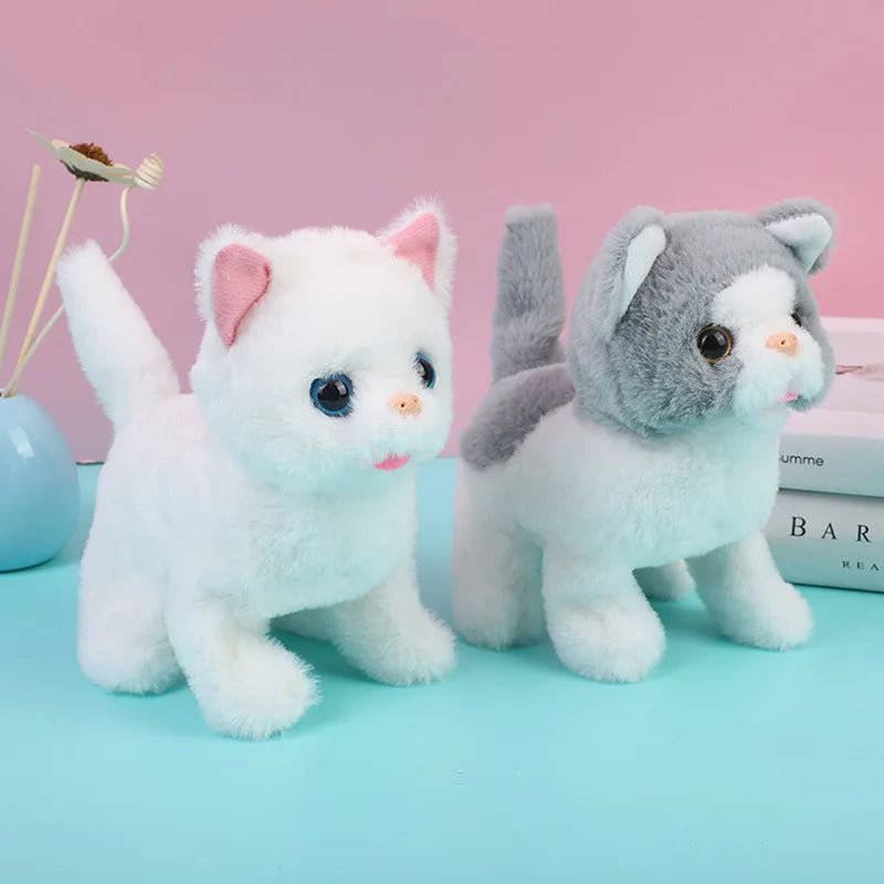 Two plush cat toys, one white and one gray, are displayed on a light blue surface.