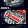 Close-up view of a motorized V8 engine building block set showing internal components and electric drive mechanism.