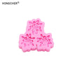 Pink silicone molds shaped like peonies and roses for resin, jewelry, and baking