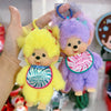 A yellow plush cartoon character with a pink collar and a purple plush cartoon character with a pink collar.