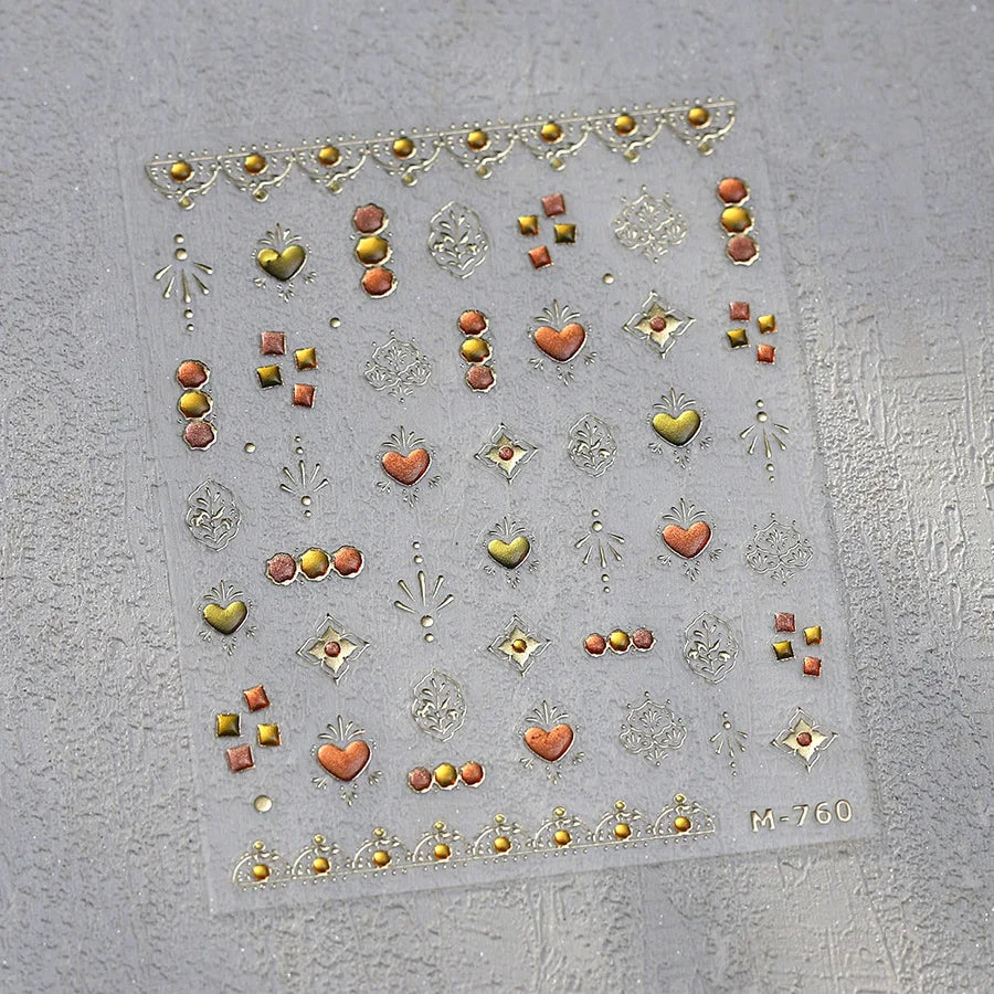 Sheet of 5D bronzing gothic nail art stickers featuring various heart and decorative elements.