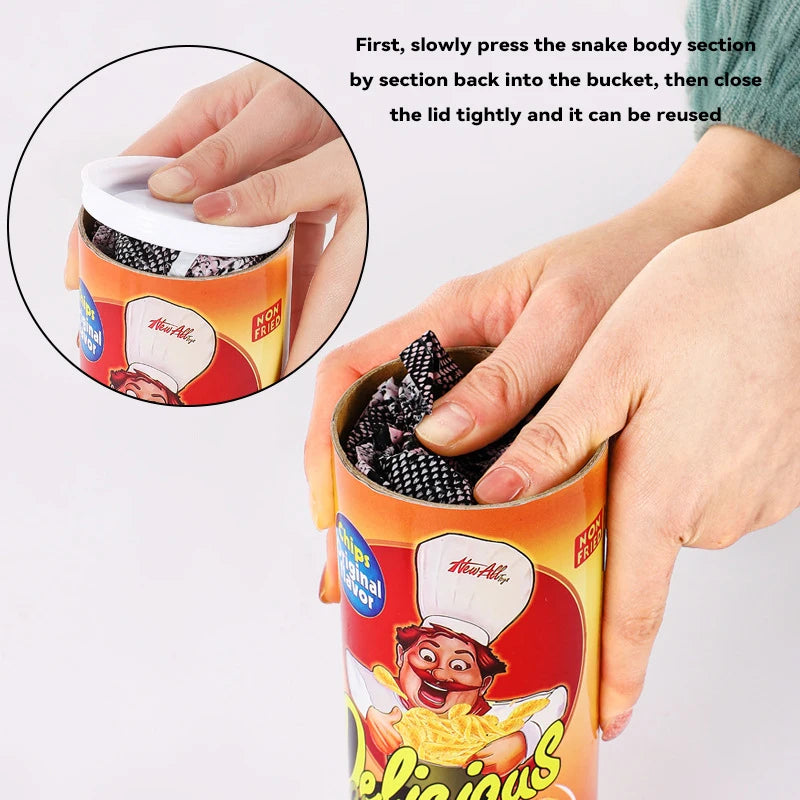 Hands demonstrate how to press the snake body section back into the bucket for reuse in a surprise toy.