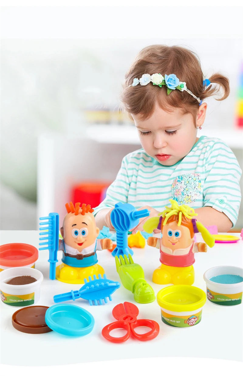 A toddler is playing with a colorful color dough haircut playset featuring various tools and hair figures.