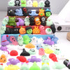 A collection of soft squishy toys in various colors and shapes arranged on a tiered stand.