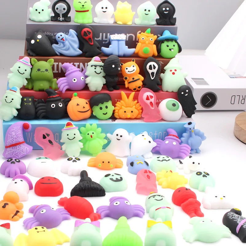 A collection of soft squishy toys in various colors and shapes arranged on a tiered stand.