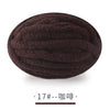 A ball of dark brown chunky chenille yarn for hand knitting projects.