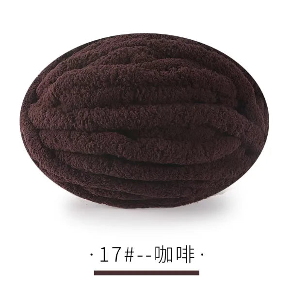 A ball of dark brown chunky chenille yarn for hand knitting projects.