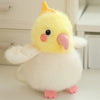 A yellow and white cartoon bird plush with pink accents, shown against a light background.
