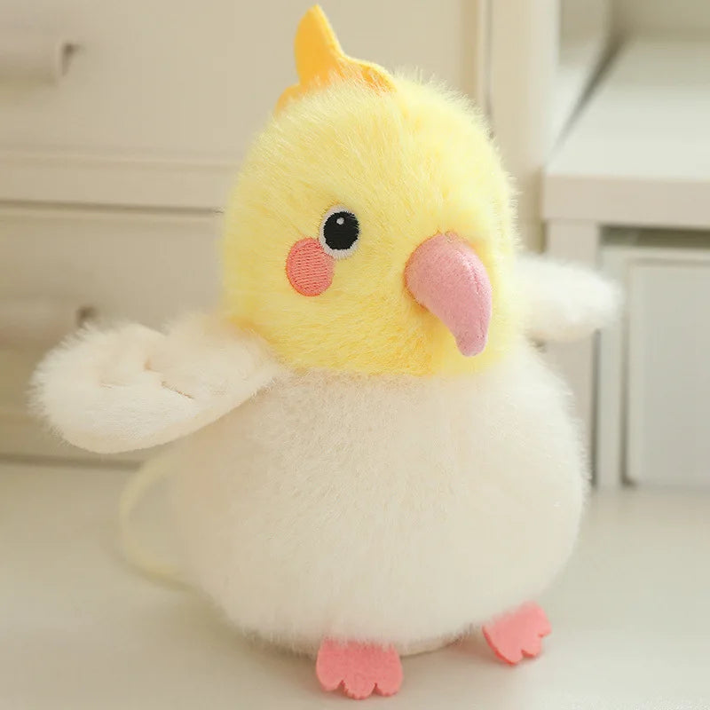 A yellow and white cartoon bird plush with pink accents, shown against a light background.
