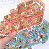 A sticker pack featuring whimsical cartoon penguins and dogs in an RV scene with colorful buildings and landscapes.