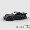 A black classic rally car model built from LEGO bricks.