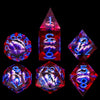 A set of seven sharp edge resin dice in various colors and shapes for role-playing games