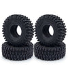 Une paire de pneus en caoutchouc souple noirs Monster pour voitures crawler RC, empilés.