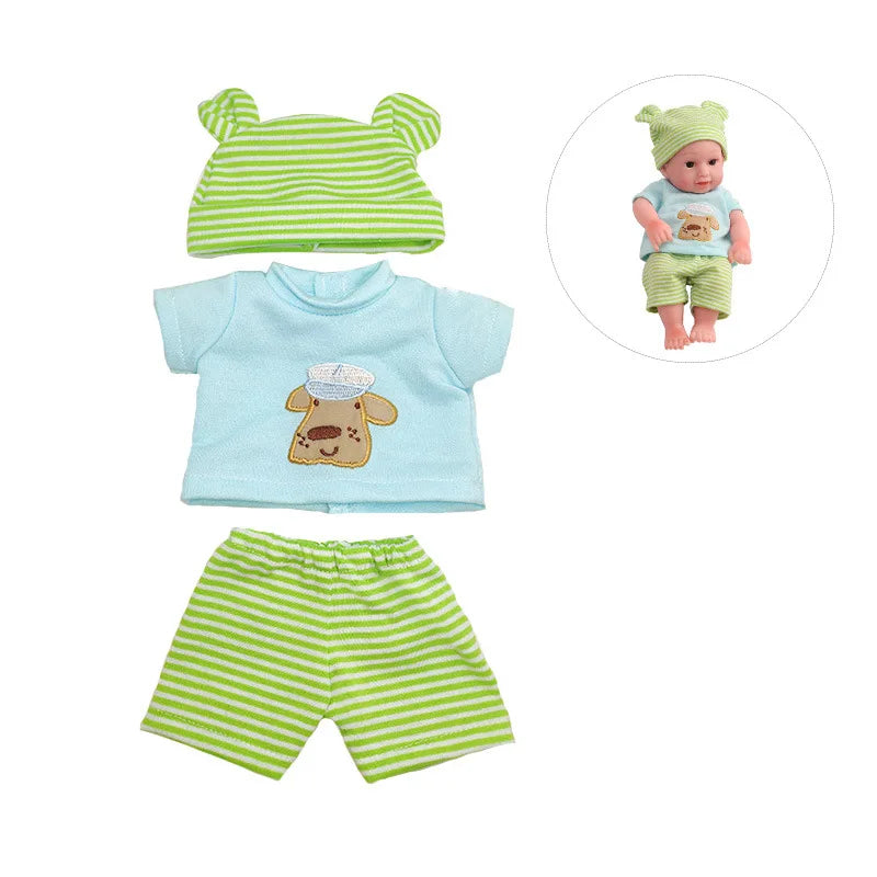 A set of green and light blue striped clothing including a top, shorts, and a doll wearing a green hat.