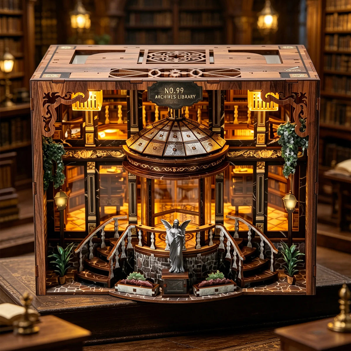 A detailed wooden miniature library model featuring shelves, stairs, and a central dome with an illuminated figure.