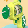 A yellow mini water blaster pistol is shown on a light blue surface, ready for use.