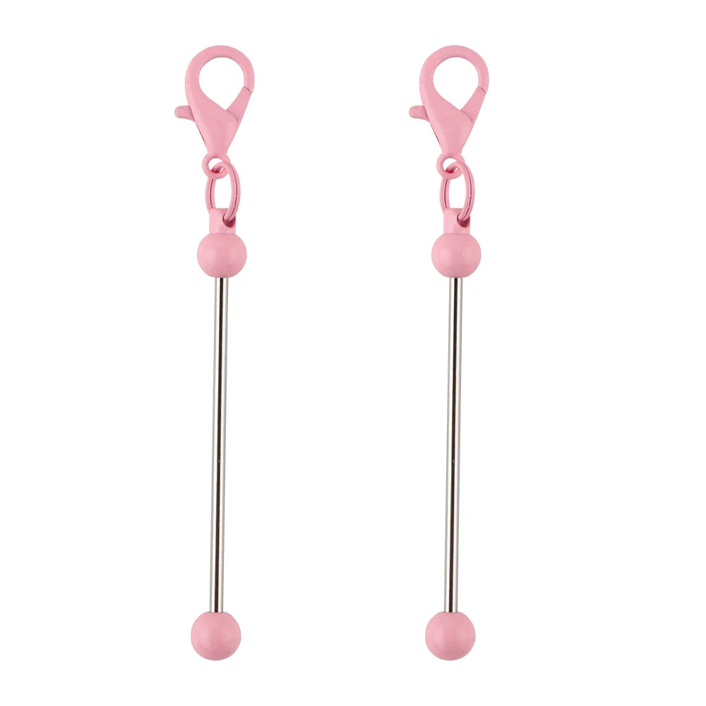 A pair of pink metal keychain bars with lobster clasps for DIY jewelry making.