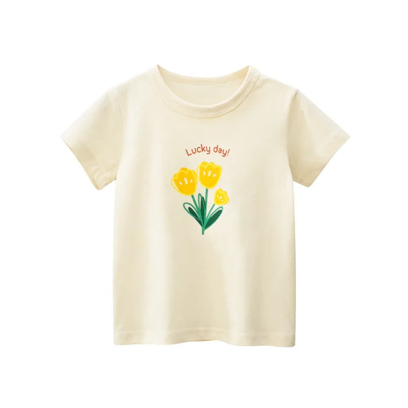 A cream-colored short-sleeve cotton t-shirt for girls featuring a yellow flower design and the text Lucky day!