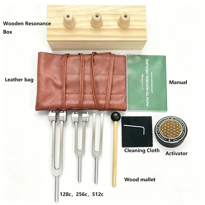 A set of sound healing tuning forks including a wooden resonance box, leather bag, manual, cleaning cloth, activator, and a w