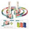 Automatic domino train toy featuring pink and green blocks and a card holder