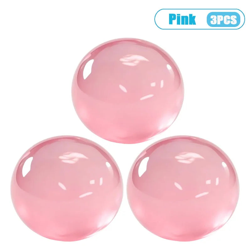 Three pink squishy stress relief balls made from handmade coconut oil