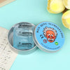 A silver tin of blue liquid glass crystal slime with a warning label next to a round container labeled Wen-Qing Slime Studio