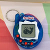 A blue electronic pet game toy with a clear display and several buttons is shown against a light background.
