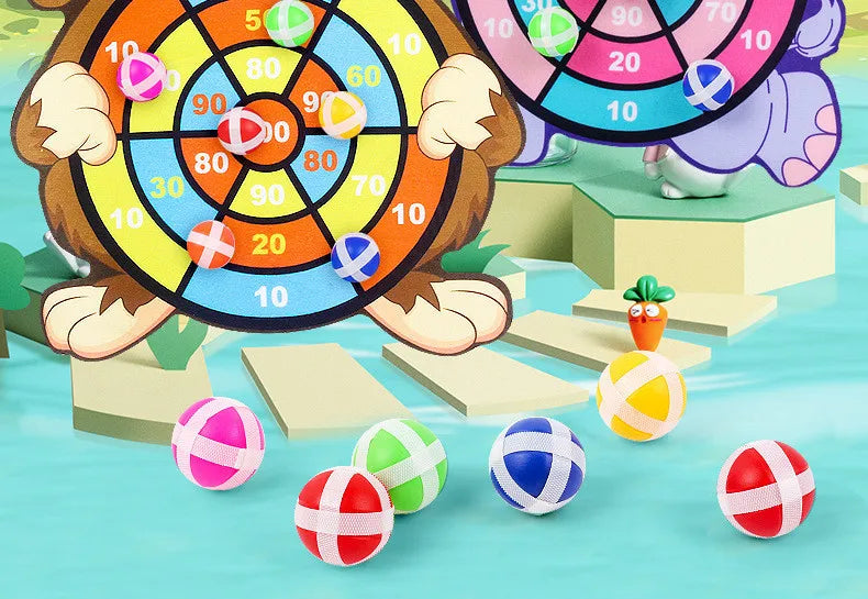 A cartoon animal character is shown holding a dart board with colored sticky balls, surrounded by various colorful balls on a