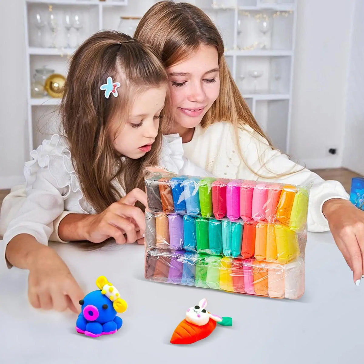 A young girl is modeling vibrant air dry clay in a clear container, with several colored clay pieces and tools on the table.