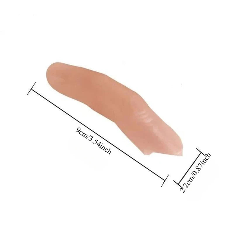 Realistic silicone fake thumb tip used for magic tricks, showing its size with a measurement.