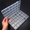 A hand opens a clear plastic storage box with dividers, showing organized compartments for jewelry and craft supplies.