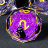 A purple liquid core resin die set featuring a cat silhouette and gold numbers on a hexagonal dice.