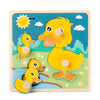 A wooden puzzle game featuring yellow duck figures and a sun, designed for toddlers.