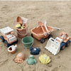 A set of kids sand and water play featuring a pull-along bulldozer trolley and various plastic toys in earth tones.