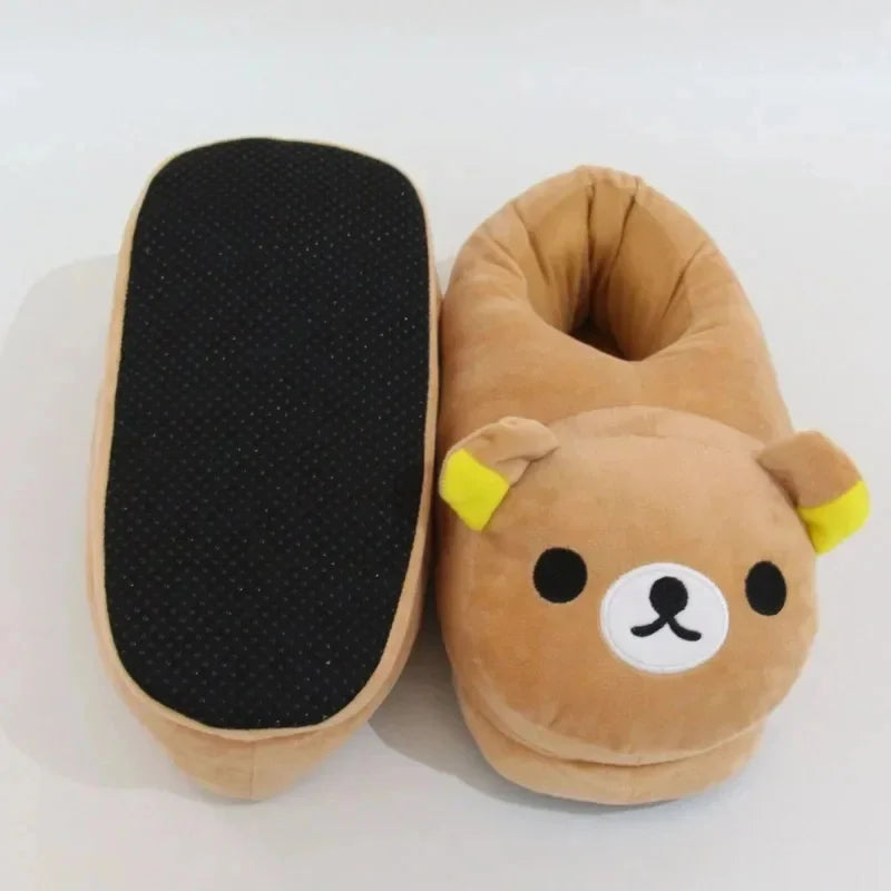 A pair of Kawaii Rilakkuma plush indoor slippers in brown with yellow accents.