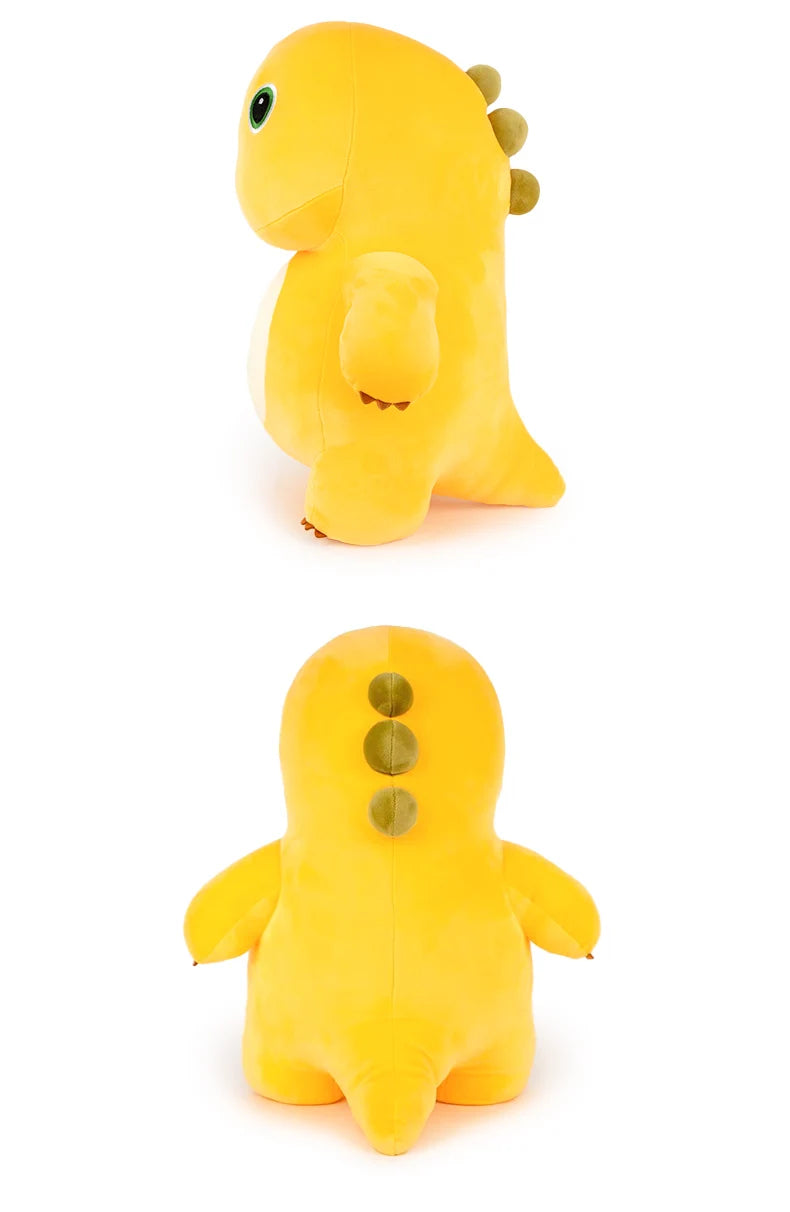 A yellow, smiling dinosaur plush toy with small green bumps and a soft texture.