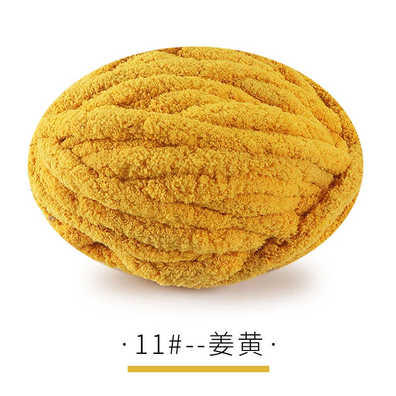 A ball of bright yellow chunky chenille yarn for hand knitting projects.