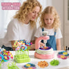 A parent and child are engaged in a fabric flower bouquet DIY craft kit using pink and green tools.