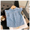 A light blue floral print girls' sleeveless shirt and shorts set displayed on a white surface.