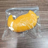 A yellow, squishy dog noodle stress relief toy is sealed in a clear plastic bag.