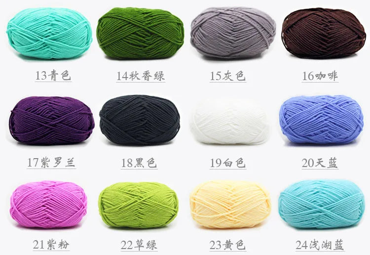 A collection of pre-dyed milk cotton yarn in various colors and shades, displayed in a row.