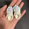 Pair of white fashion slippers for 1/6 BJD dolls with light blue and pink floral accents