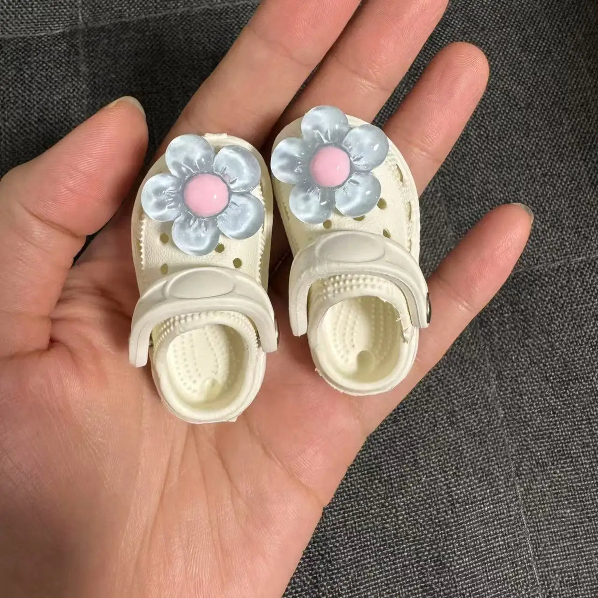 Pair of white fashion slippers for 1/6 BJD dolls with light blue and pink floral accents