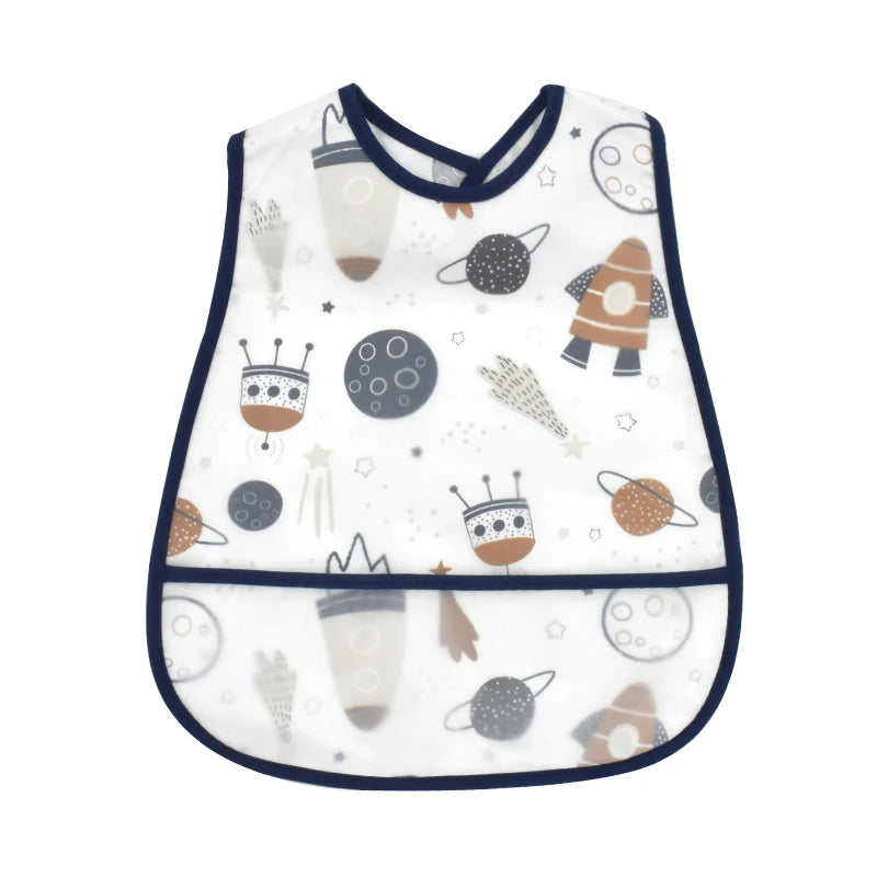 A white baby bib featuring a cartoon pattern of planets and space elements.