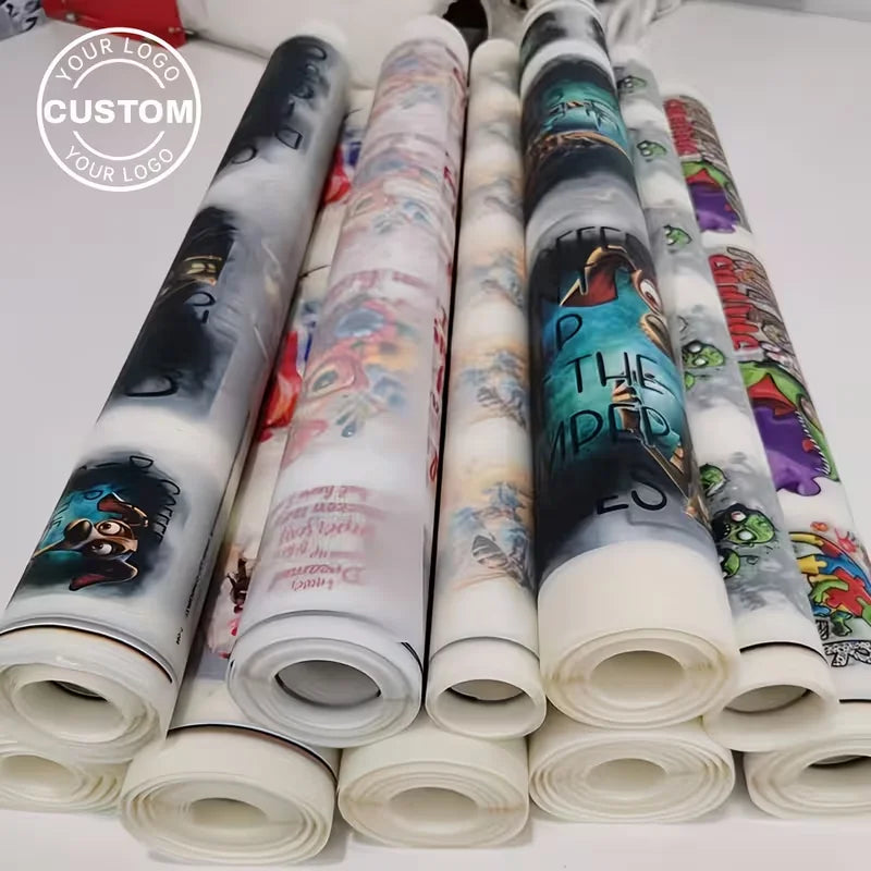 Rolls of custom iron-on heat transfer stickers for DIY clothing displayed in a row.