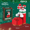 A set of 160 Christmas building blocks shaped like Santa and a reindeer, displayed on a green background.