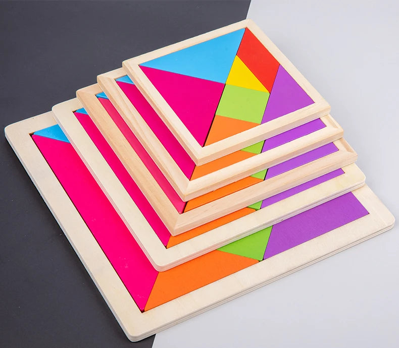 A wooden tangram puzzle set showing seven colored triangular pieces arranged in a pyramid formation.